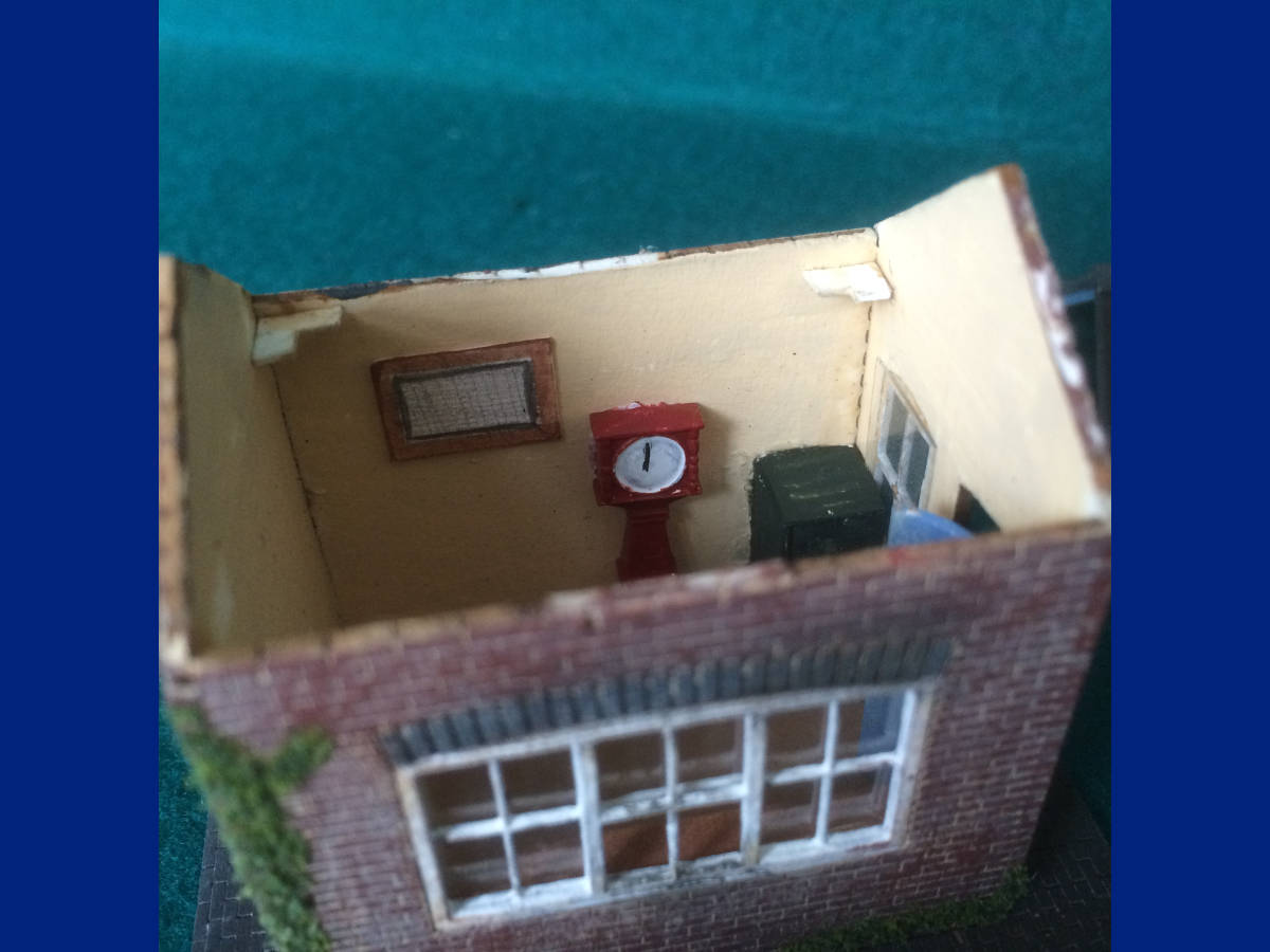 " Painted with a mix of enamel and acrylic paints, weathered using mostly powders, with a bit of dry-brushing for good measure. Interiors are fitted out, although the weighbridge still needs a chair or two. "